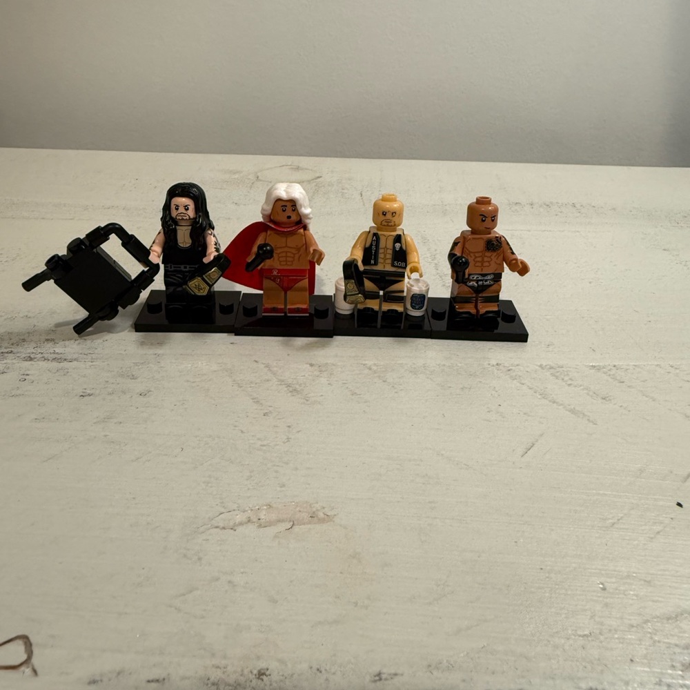 WWE Legend - The Undertaker, Ric Flair, Stone Cold Steve Austin, and The Rock.